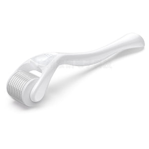 White facial roller on a white background